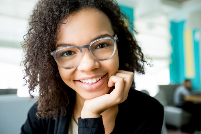 Curly hair girl wearing eyeglasses